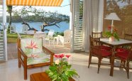 The-living-room-and-patio-of-a-1-bedroom-villa-with-view-over-San-San-Bay